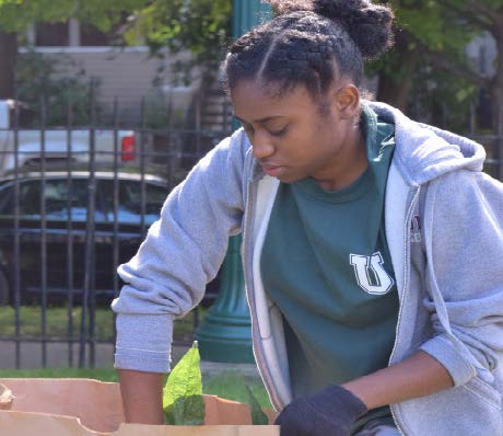 Green Grant recipient Kayla Quarless ’21 working in the Octopus’s Garden, which she will support with her grant. Photo by Katarina Zahedi.