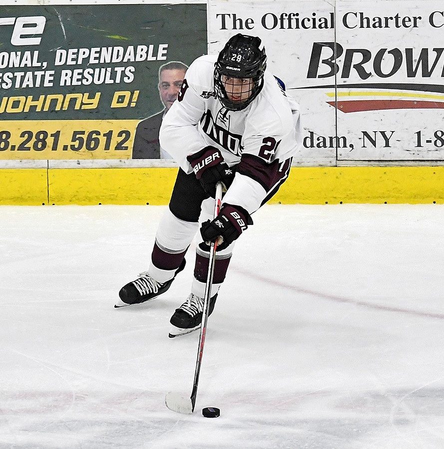 Sean Harrison ’21 passing the puck. Photo courtesy of Ross Ladue.