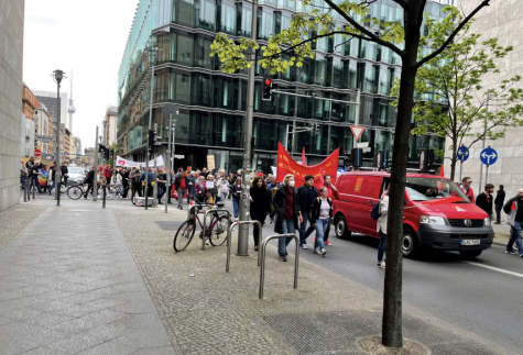 Labor organizers associated with the German labor union confederation march with banners and signs in the heart of Berlin, near the federal parliament on May Day. 