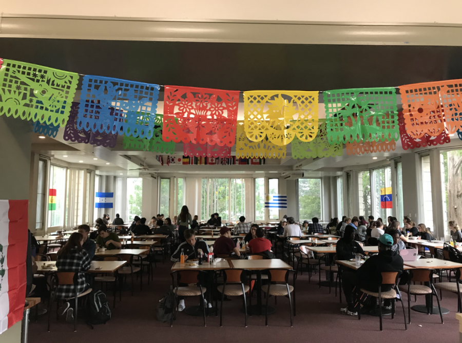 Flags of countries in Latin America, including Cuba, Puerto Rico, Venezuela, Peru, and Colombia were set up around dining tables. While eating Hispanic cuisine, students also enjoyed vigorous music. 