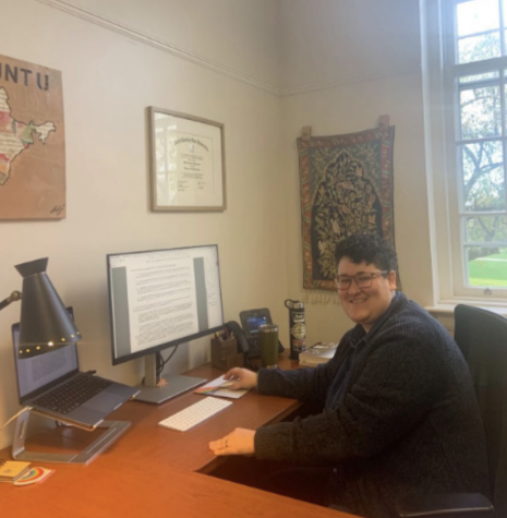 Professor Mary Guerrant working at their desk. They can be reached at guerranm@union.edu.