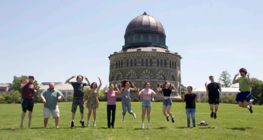 Students from Anime Club in 2020 jump for a group photo in front of the Nott Memorial. Anime Club uses its Discord server to connect between different generations of club members. 