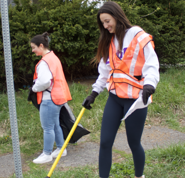 Sisters of the Delta Phi Epsilon sorority cleaning at the Goose Hill Neighborhood
cleanup.