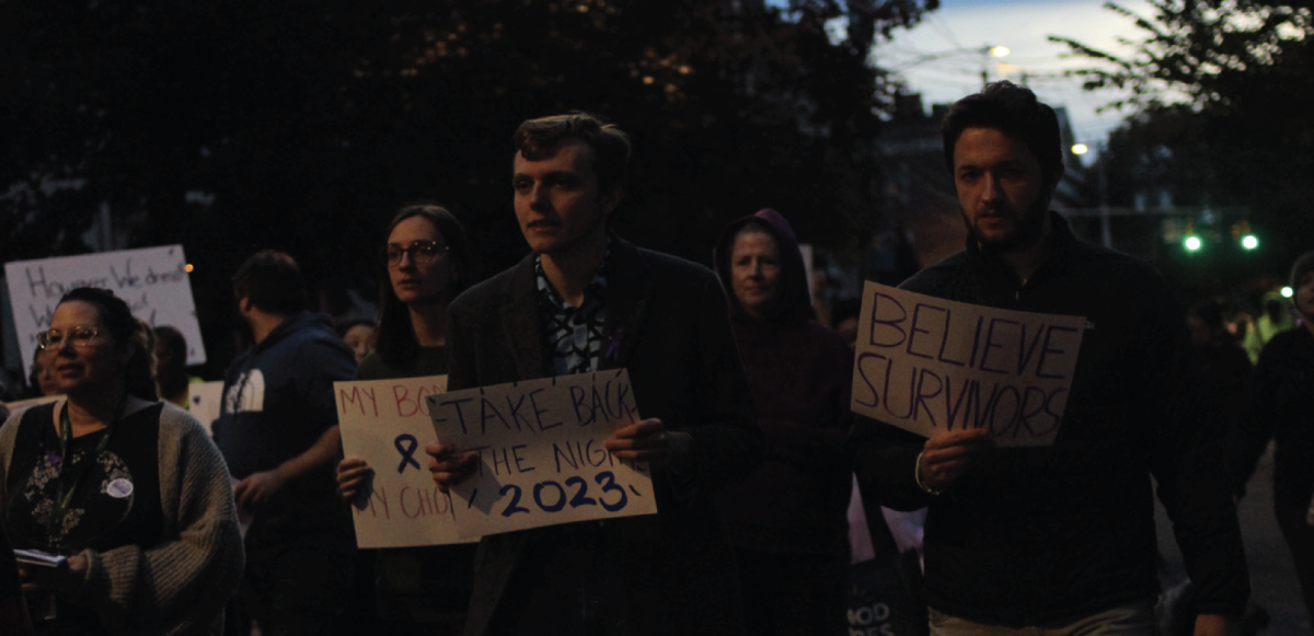 Ryan Cudworth ‘25, Gabby Baratier ‘25, and Jason D’Amico ‘24 marching.