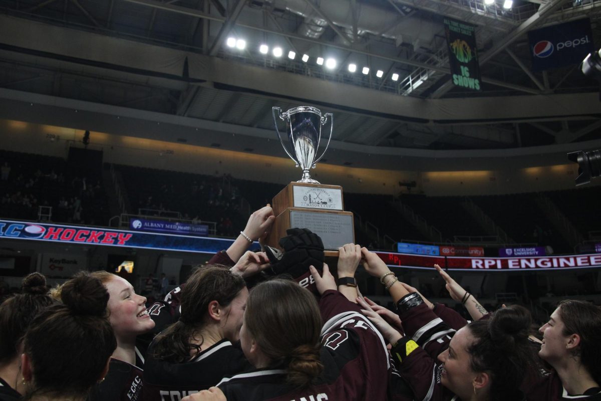 The women's team holding the cup after their first cup win in five years. 