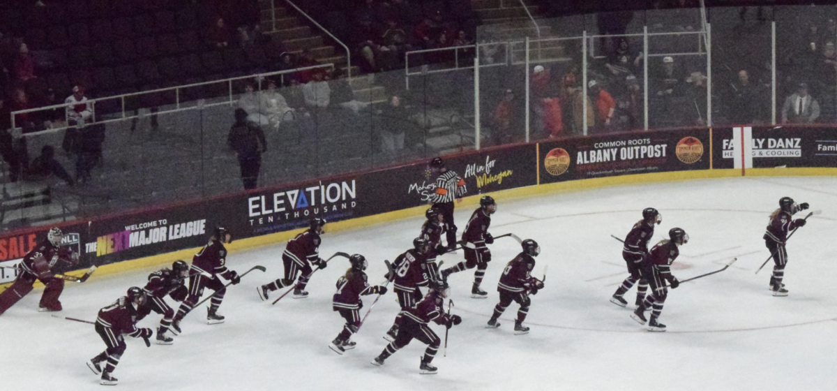 The women's team clearing the bench at the end of the third period. 