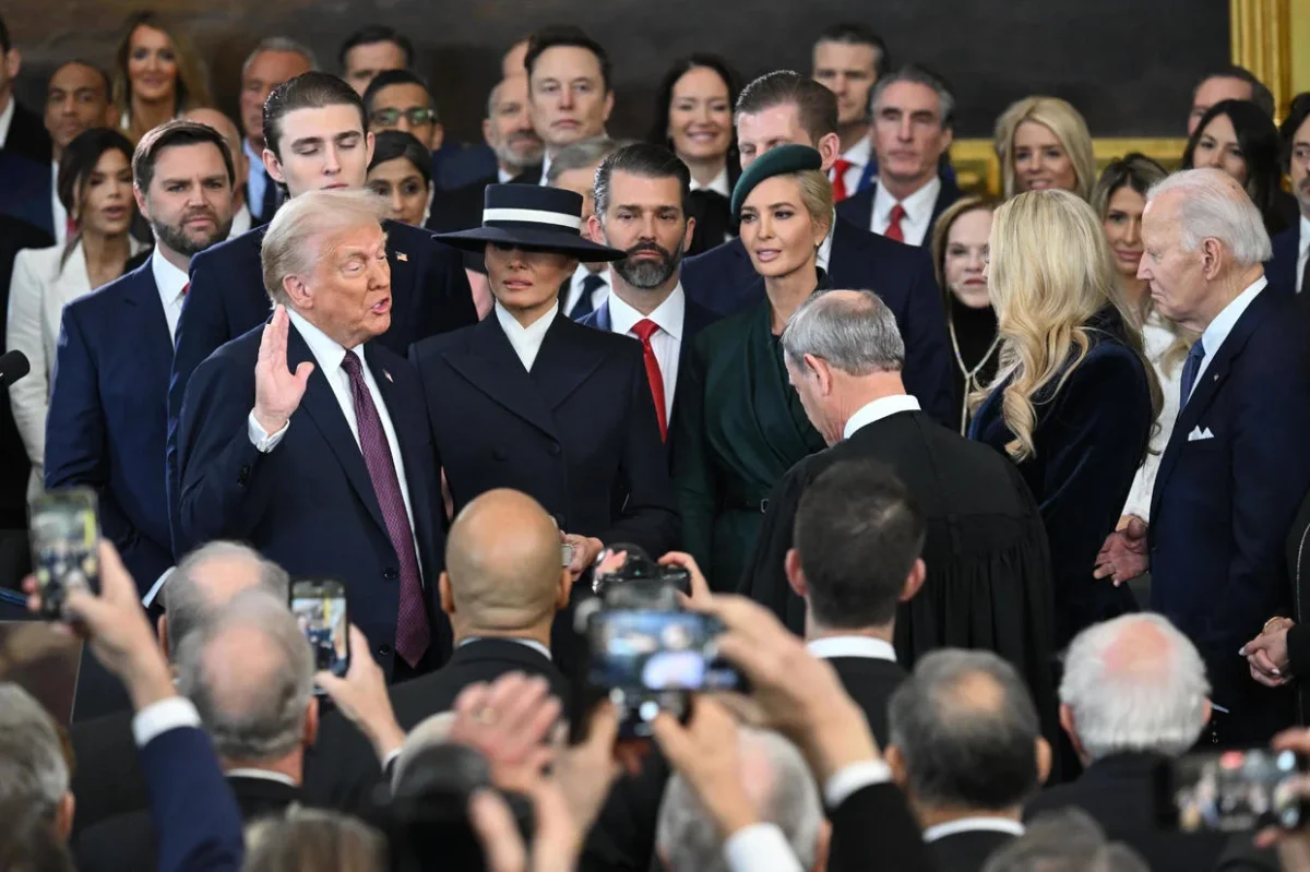 President Trump sworn into office, surrounded by family and friends. 