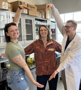 Professor Curley (center) with students in her research lab, one of several campus labs that receives federal funding. 