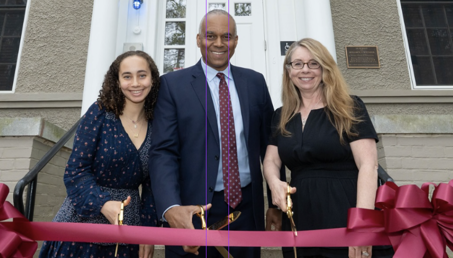 President Harris cuts the ribbon to the newly renamed Harris House.