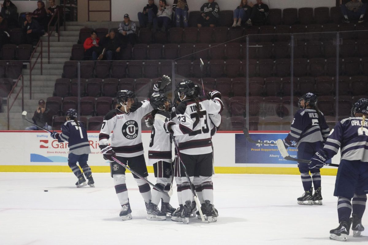 Union Women's Hockey players celebrate after they score against St. Anslem in the first game of the icebreaker tournament. 