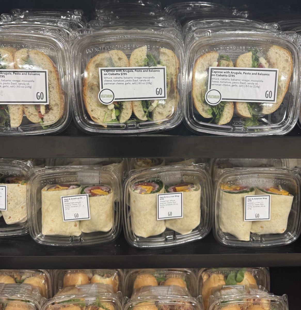 Rows of plastic containers with sandwich options in Union’s C-Store
