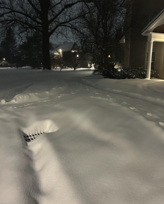The front of the Career Center on the night of Sunday, January 25. A curb is completely covered in snow and invisible.