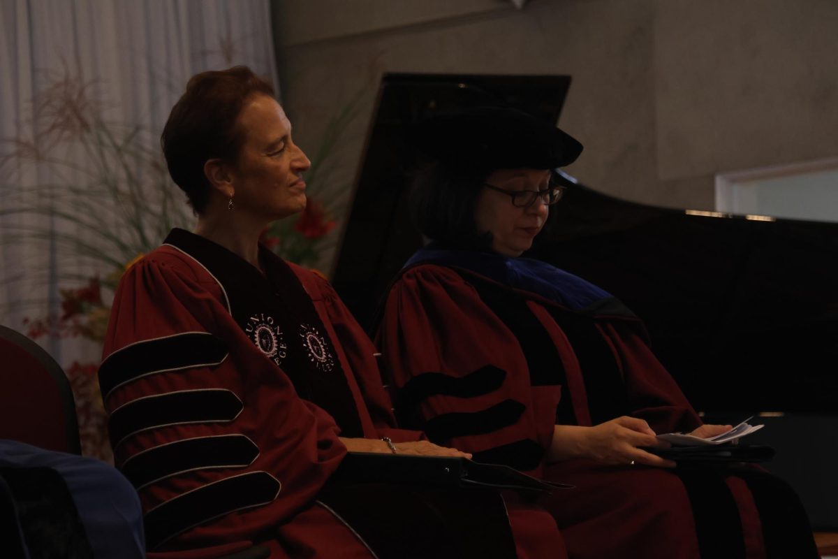 President Kiss and College Marshal Stacie Raucci at Kiss's inauguration on October 10, 2025. 