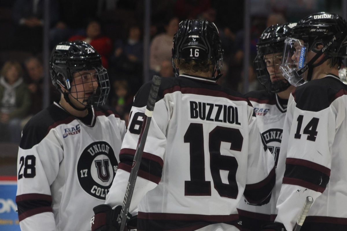 Étienne Lessard '29, Lucas Buzziol '28, Tyler Dunbar '27 and Brandon Buhr '26 discuss 4-on-4 play during the game against Yale on January 17, 2026. 
