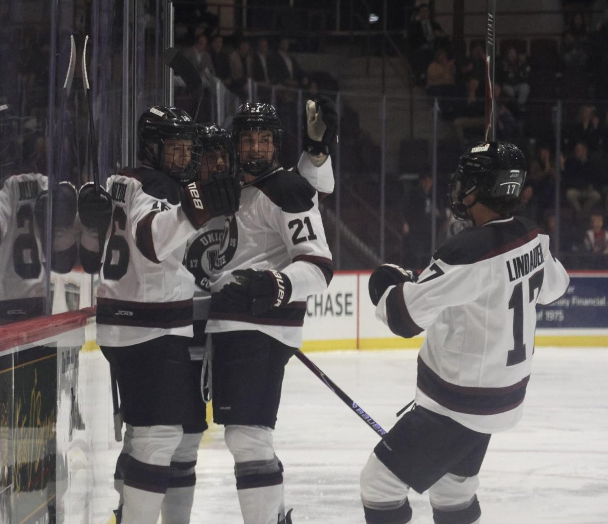 A Union men's hockey penalty kill unit celebrates after Lucas Buzziol '28 scored a short handed goal against UMass Lowell on November 14, 2025. 