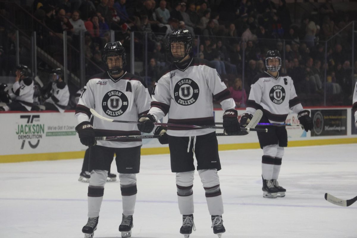 Colby MacArthur '26, Parker Lindauer '26, and captain Nick Young '26 at their game against Yale on January 17, 2026. 