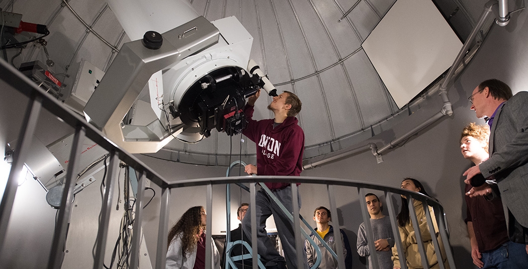 Students in the Union College Observatory using the 20-inch optical telescope, available in classes like The Solar System with Lab