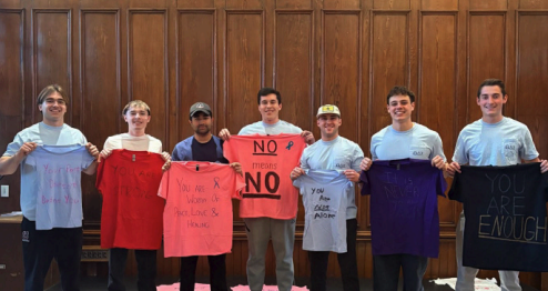 A picture of the brothers of Thetha Delta Chi building awareness for Sexual Assualt Awareness Month. 